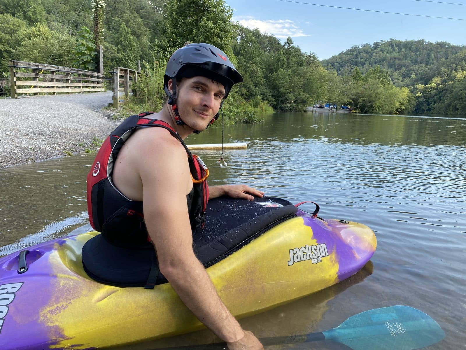 Dr. Smith with his whitewater kayak at the river's edge