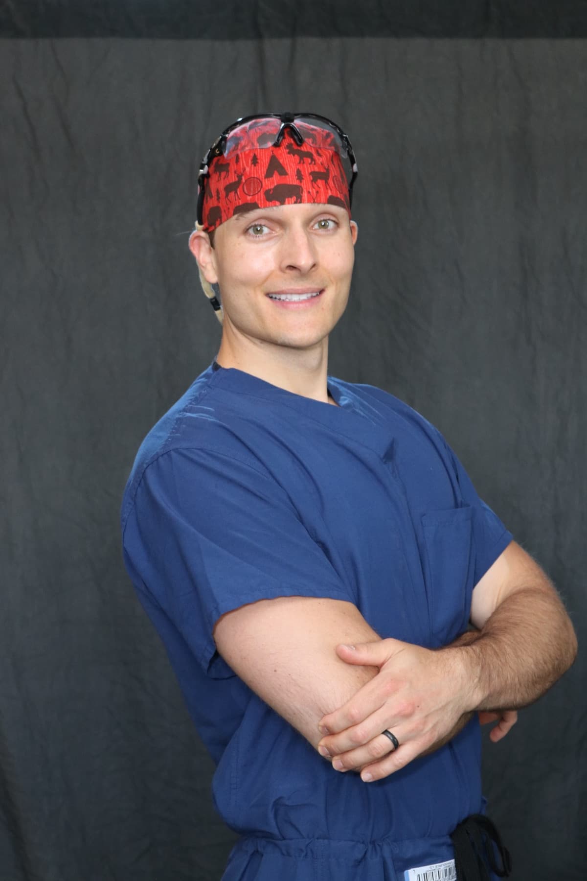 Dr. Justin T. Smith, MD, in surgical scrubs